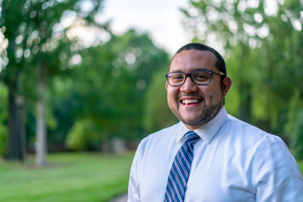 Ricky Hurtado, NLC North Carolina, looking forward at the camera, wearing a tie.